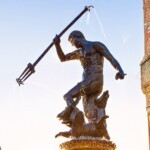 Poland, Gdansk, Famous Neptune fountain at sunset. Popular tourist attraction and travel destination in Europe