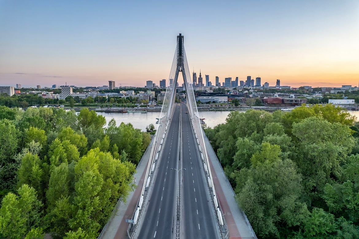 A bridge with the Warsaw skyline in the background