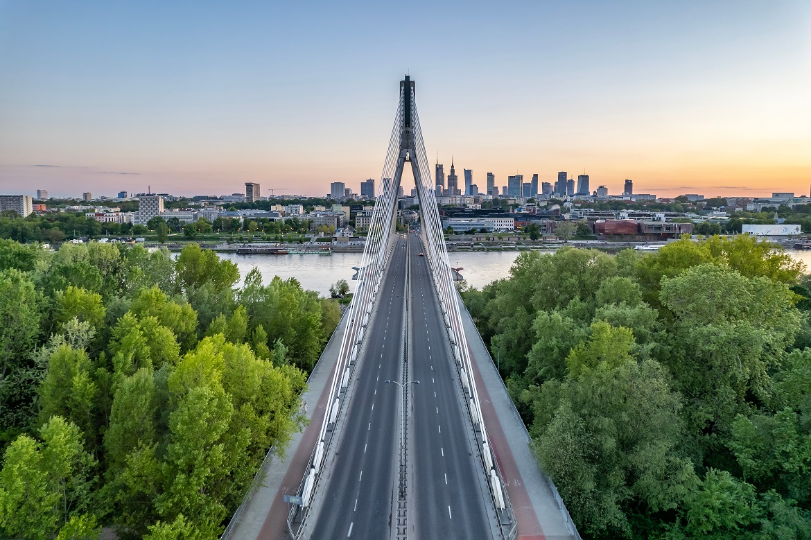 A bridge with the Warsaw skyline in the background