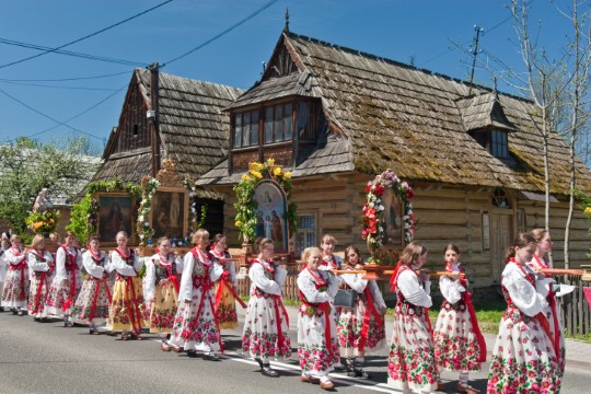 children in folk costumes on a procession 