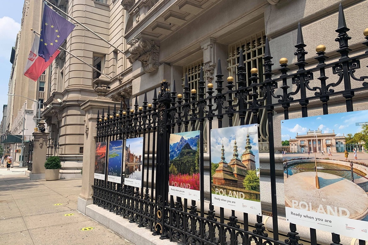 posters mounted on a fence