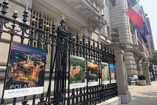 posters mounted on a fence