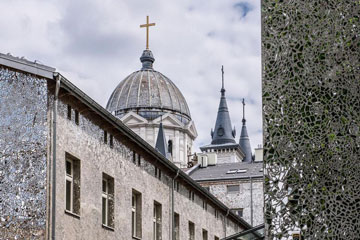 rooftops, church spire, glass mosaic on the wall