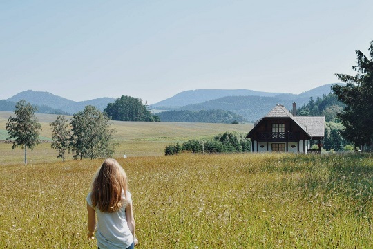 A girl stading in a field 