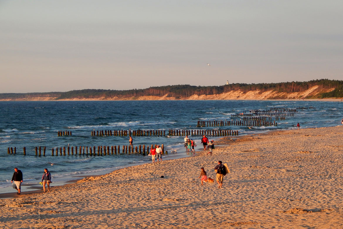 Beach with people walking